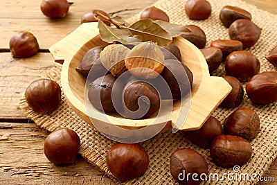 Chestnut on rustic wooden table Stock Photo