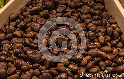 Chestnuts in basket in supermarket, first-person view Stock Photo