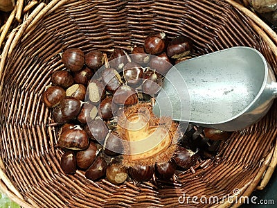 Chestnuts love heart in the basket bailer in market place food background colors Stock Photo