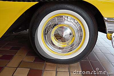 Chevrolet 210: Close-up of the wheel, sedan, year 1956, yellow color, taxi Editorial Stock Photo