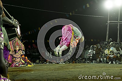 Chhau dance or Chhou dance of Purulia. Acrobatic male dancer vaulting in air. Editorial Stock Photo