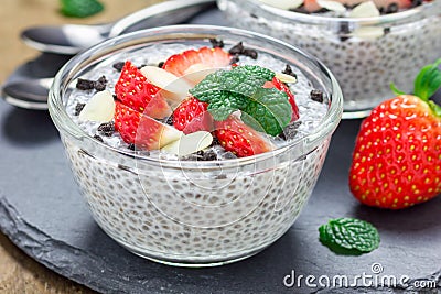 Chia seed pudding with strawberries, almond and chocolate cookie crumbs Stock Photo