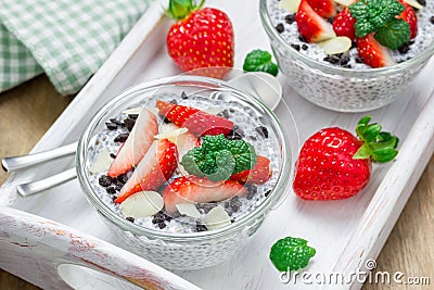 Chia seed pudding with strawberries, almond, chocolate cookie crumbs Stock Photo
