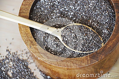 Chia seed in a wooden spoon on the table. Healthy eating. Vegan food concept Stock Photo