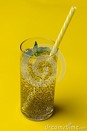 Chia water drink with lemon and mint on colored background Stock Photo