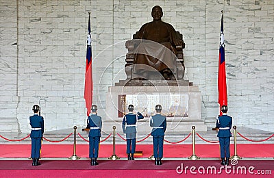 Chiang Kai-Shek Memorial Hall, Taipei, Taiwan - May 7, 2017 : the honor guards saluting against the statue of Chiang Kai-Shek Editorial Stock Photo