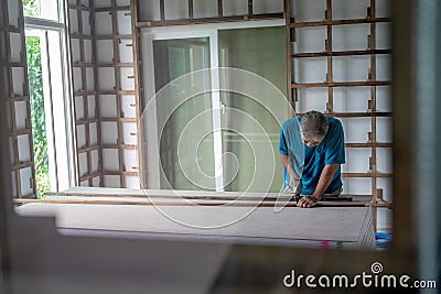 Chiang Mai, Bangkok - 5 November 2019: Shot of old master carpenter working in his woodwork or workshop Editorial Stock Photo