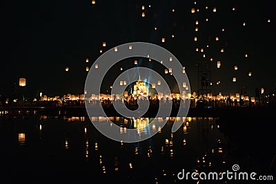 Chiang Mai lantern festival with lantern flying on the sky and crowd of people who is going to release the lanterns Stock Photo