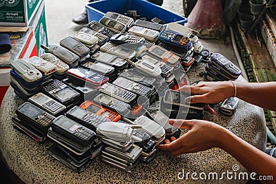 Chiang Mai Thai 15 june 2017 Many old mobile phones are discarded as toxic e-waste, but there are also groups of people who buy Editorial Stock Photo