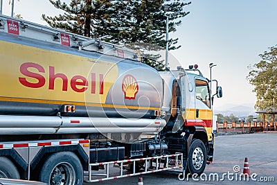 Chiang Mai, Thailand - Dec 15, 2020: Shell Gas Station and Trailer Truck During Sunset. Royal Dutch Shell Oil and Gas Industry Editorial Stock Photo