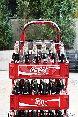 Chiang Mai, Thailand - December 23, 2017: Glass Coca-Cola bottles in red plastic boxes. Editorial Stock Photo