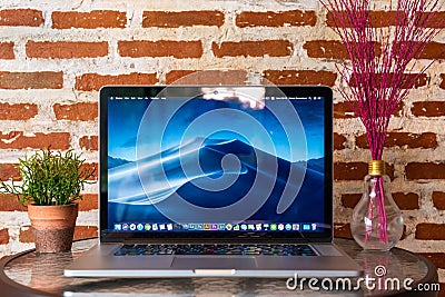 Macbook computers on table Editorial Stock Photo