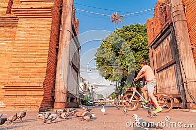 Tourist on rental bike at Thapae Gate in Chiang Mai city. Editorial Stock Photo
