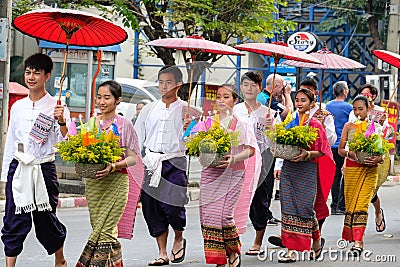 women and men in the annual flower festival parade in Chiang Ma Editorial Stock Photo