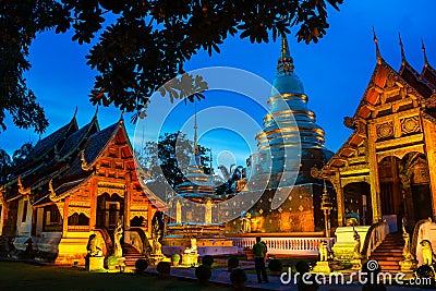 Chiang Mai, Thailand. Illuminated temples of Phra Singh Stock Photo