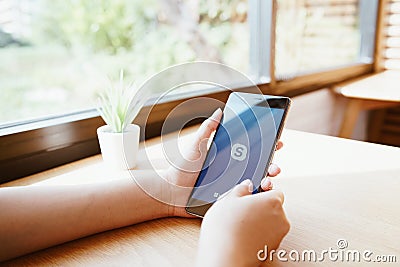 CHIANG MAI, THAILAND - JAN. 19,2019: Woman holding HUAWEI with skype apps. Skype is part of Microsoft, can make video, audio calls Editorial Stock Photo