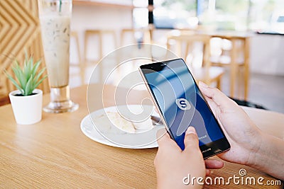 CHIANG MAI, THAILAND - JAN. 19,2019: Woman holding HUAWEI with skype apps. Skype is part of Microsoft, can make video, audio calls Editorial Stock Photo