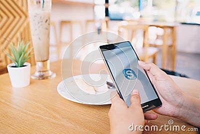 CHIANG MAI, THAILAND - JAN. 19,2019: Woman holding HUAWEI with skype apps. Skype is part of Microsoft, can make video, audio calls Editorial Stock Photo