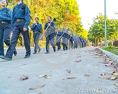 Agricultural university students in blue uniform and field hoe o Editorial Stock Photo