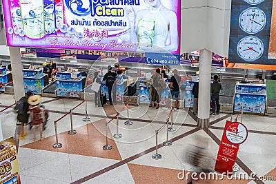 Tourists and travellers wait in line to check in at Chiang Mai International Airport check in counters Editorial Stock Photo