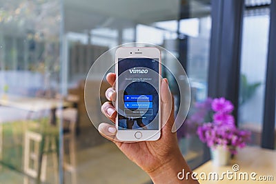 CHIANG MAI, THAILAND - Mar 02,2018: Man holding Apple iPhone 6S Rose Gold with Vimeo on screen. Vimeo is a video-sharing website Editorial Stock Photo