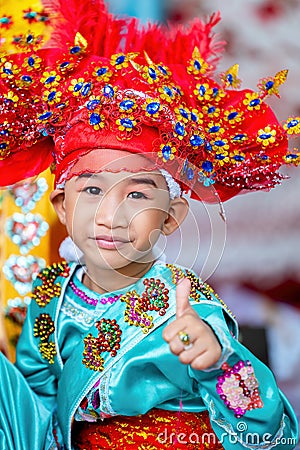 CHIANG MAI, THAILAND - MARCH 25 2023 : A boy thumbs up in Poy Sang Long festival, A Ceremony of boys to become novice monk, In Editorial Stock Photo