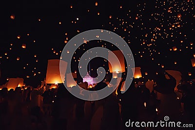 Chiang Mai - Thailand November 27, 2023 : Tourists happily celebrate releasing lanterns at the Loi Krathong Yi Peng Lantern Editorial Stock Photo