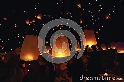 Chiang Mai - Thailand November 27, 2023 : Tourists happily celebrate releasing lanterns at the Loi Krathong Yi Peng Lantern Editorial Stock Photo