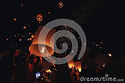 Chiang Mai - Thailand November 28, 2023 : Tourists happily celebrate releasing lanterns at the Loi Krathong Yi Peng Lantern Editorial Stock Photo