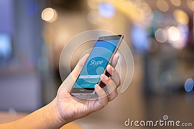 CHIANG MAI, THAILAND - Oct. 28,2018: Man holding HUAWEI with skype apps. Skype is part of Microsoft, can make video, audio calls, Editorial Stock Photo