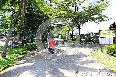 2023-05-01:Chiang Mai Thailand:Tourists, small families cycle around one of the attractions Editorial Stock Photo