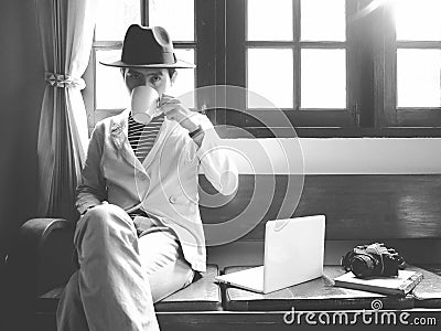 CHIANGMAI ,THAILAND - April 25, 2017 : A man is sitting at vintage sofa, He is a freelance photography. At the present Editorial Stock Photo