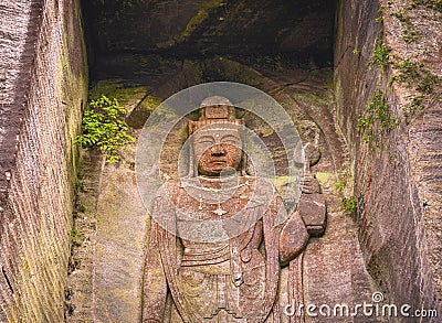 Close-up on the Hyaku-shaku kannon buddha carved in Mount Nokogiri stone quarry. Editorial Stock Photo