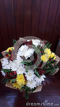 Chic bouquet of chrysanthemum amid wood Stock Photo