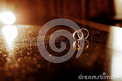 chic gold rings close-up on the table of the newlyweds Stock Photo