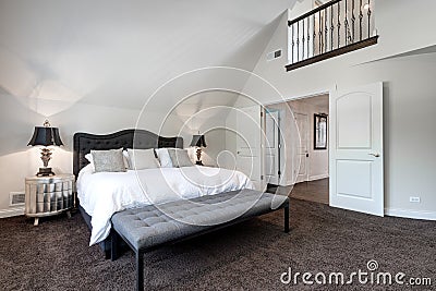 A large bedroom with a loft up above. Editorial Stock Photo