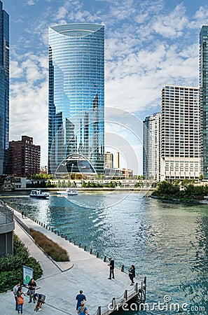 Chicago River Boardwalk with People, Boats and Office Buildings Editorial Stock Photo