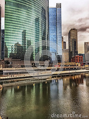 Chicago`s cityscape multi-colored reflection on a freezing Chicago River in January Editorial Stock Photo