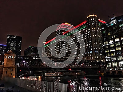 Chicago`s el train passes through the city, illuminated with Christmas holiday decorations. Editorial Stock Photo