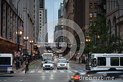 Chicago street bustling with life and cars commuting Editorial Stock Photo