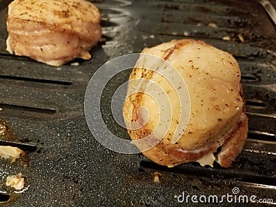 Chicken and bacon on baking sheet Stock Photo