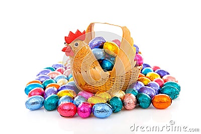 Chicken basket with colorful easter eggs Stock Photo