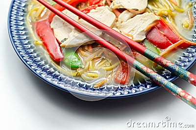 Chicken broth with ginger and black fungus mushrooms, high protein wheat noodles, sliced steamed chicken breast, julienne carrots Stock Photo