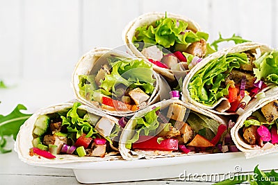 Chicken burrito. Healthy lunch. Mexican street food fajita tortilla wraps Stock Photo