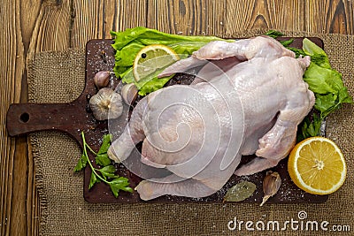 Chicken carcass on a cutting Board on a wooden table Stock Photo