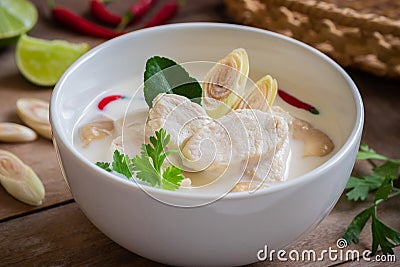 Chicken with coconut milk soup in bowl, Thai food Tom Kha Kai Stock Photo