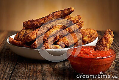 Chicken crispy strips with salsa Stock Photo