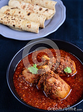 Chicken Curry with Indian bread Stock Photo