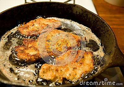 Chicken cutlets frying Stock Photo