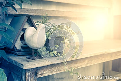 Chicken doll statue and wooden small house Stock Photo